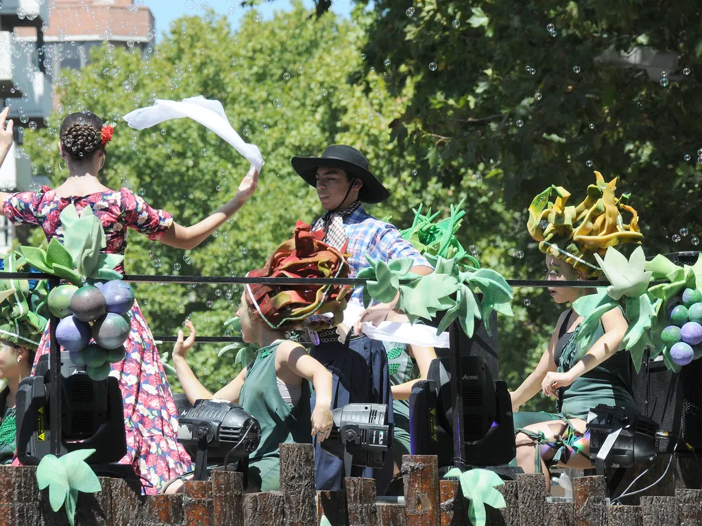 Folklore dancers dancing on one of the grape harvest floats.